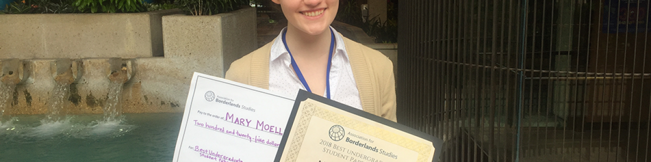 Mary Moeller poses with her award letter