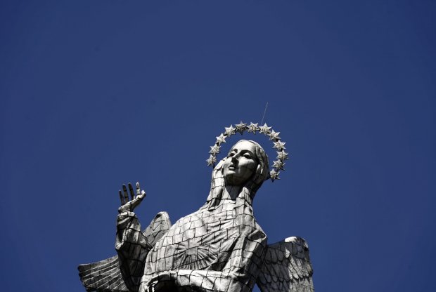 Looking up at El Virgen de El Panecillo with blue skies in the background. The statue is more than 125 feet high and sits atop the hill of Panecillo overlooking Quito. Sean Patrick Curtis/WWU