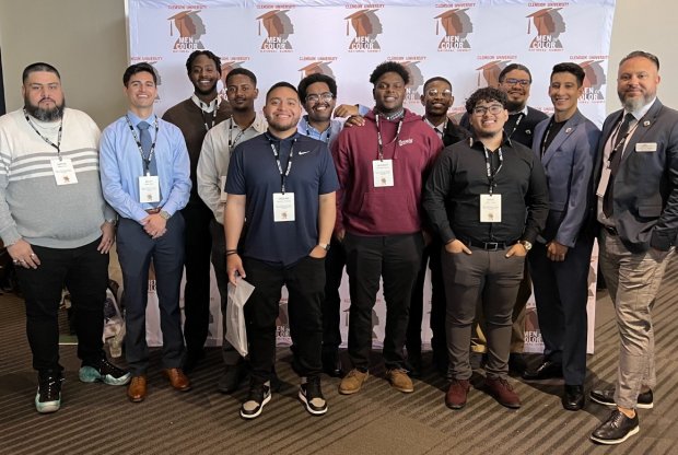 Students attending the Men of Color Summit pose for a picture at the event