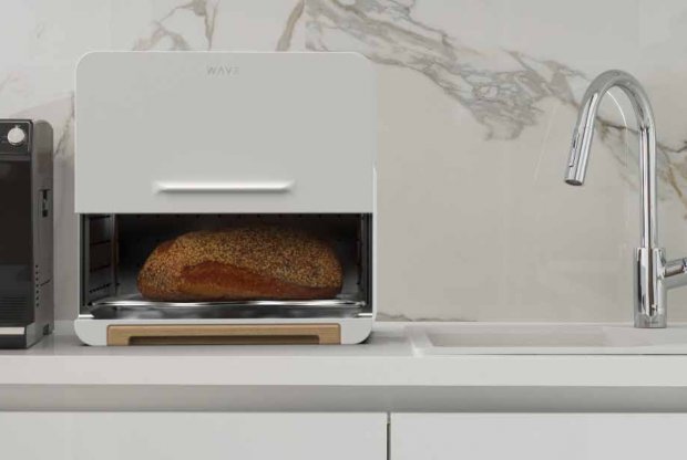 a white bread box sits on a kitchen countertop