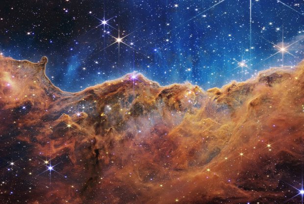 The Carina Nebula is captured in infrared light by NASA’s new James Webb Space Telescope, revealing for the first time previously invisible areas of star birth.
