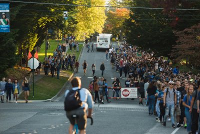 The procession of students, faculty and staff heads downtown