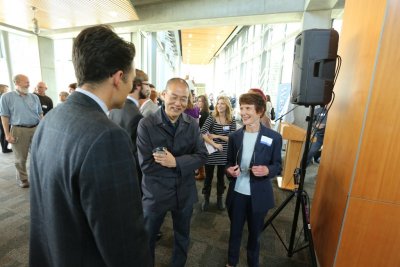 Western's Paul Dunn and Western Gallery Director Sarah Clark-Langager chat with sculptor Do Ho Suh about the dedication of his piece, "Cause & Effect" in Western's AIC West.
