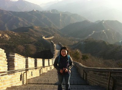 Assistant Professor of Sociology Baozhen Luo poses for a photo on the Great Wall. Courtesy photo