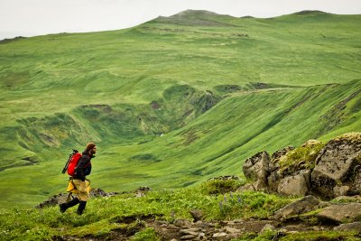 DeChaine hikes across the dramatic landscape of Tanaga Island in the Aleutians.