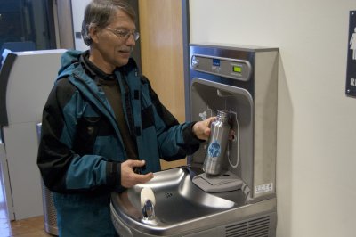 Western anthropology professor James Loucky fills his water bottle at the Wade King Student Recreation Center water bottle refilling station after installation finished Monday, January 9. Two other stations have been installed on the second floor of Old M