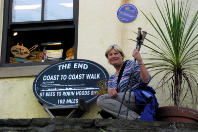 Cheryl Danielsen poses at the end of the Coast to Coast walk across England.