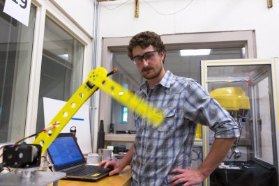 For his senior project, Nicolas Howard worked with fellow student Ben Bisset on a three-axis robot for the Engineering and Design Department to help future students learn more about robotics and kinematic motion. Photo by Jonathan Williams / WWU