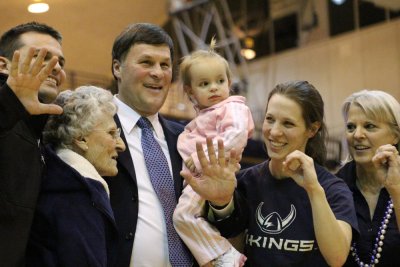 Brad Jackson and his family represent "500" with their hands after Jackson earned his 500th win as a coach Thursday night in Carver Gym. The Vikings defeated Saint Martin's University 76-71. Photo by Lillian Furlong | For WWU Athletics