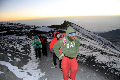 Tim Scharks' climbing team crests the final ridge to the Mt. Kilimanjaro summit before dawn. Photo by Tim Scharks