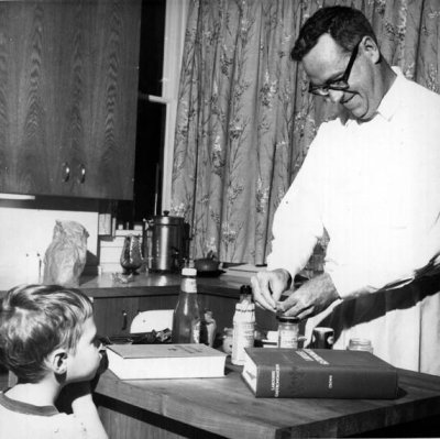 Dr. Jarrett cooking breakfast in what was the President's House, now Canada House. Photo courtesy of WWU Special Collections