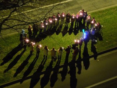 Several of Morgan Livingston's current and former students hold a candlelight vigil outside her hospital room window on Saturday, Jan. 7, 2012. Additional students held a second vigil the next morning. Livingston, aware of the students' presence, smiled a