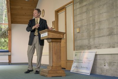 Richard Van Den Hul, the vice president for Business and Financial Affairs at Western Washington University, addresses a crowd of WWU and PSE officials at a ceremony Friday, April 24, on WWU's Bellingham campus. Image courtesy Carey Rose, Puget Sound Ener