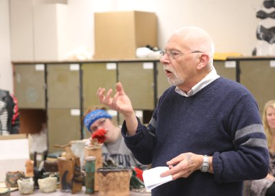 Western Ceramics Professor Pat McCormick gives a verbal evaluation of a student’s ceramics piece during a class in the Fine Arts Annex. During the lecture, McCormick gave advice to all students on how to mix and apply glazes properly and taught them that 