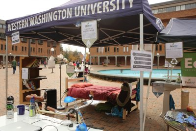 Western Washington University’s Residents’ Resource Awareness Program, ResRAP, constructed a mock dorm room in Red Square during Sustainability Week to show students how they can alter their living habits for a more sustainable future. Photo by Brianna Ku