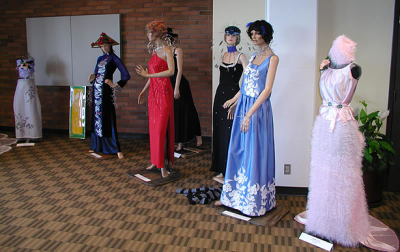 Thomas Tran designed and created these dresses, shown here at the 2003 Staff Arts and Crafts Show at Western. Tran also designed and created the hats. Courtesy photo | WWU