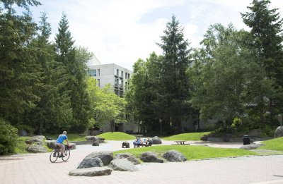 People enjoy lunch and bike riding near Haskell Plaza on South Campus
