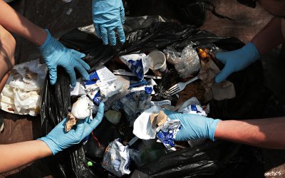 Volunteers sort through trash and categorize them by usability during a recent waste audit on the Western Washington University campus. Students for Renewable Energy, the Air and Waste Association and the Office of Sustainability conducted a campus waste 