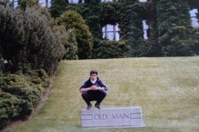 Yuki Watanabe's father, Norihito, poses on a sign for Old Main during his stay at Western Washington University as an exchange student in 1983. Courtesy photo