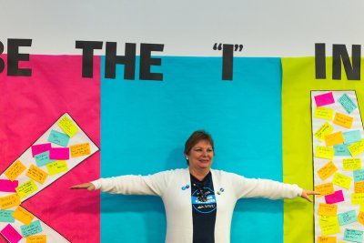 Employee Nancy Phillips is the "i" in Kindness on the Kindness Wall